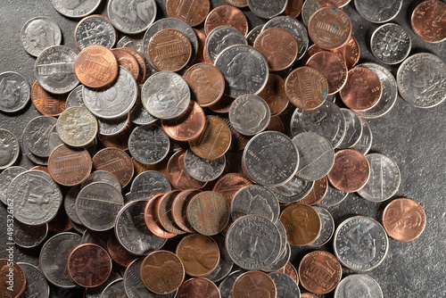 US Dollar coins, different coins piled up. Dime, quarter penny coins background