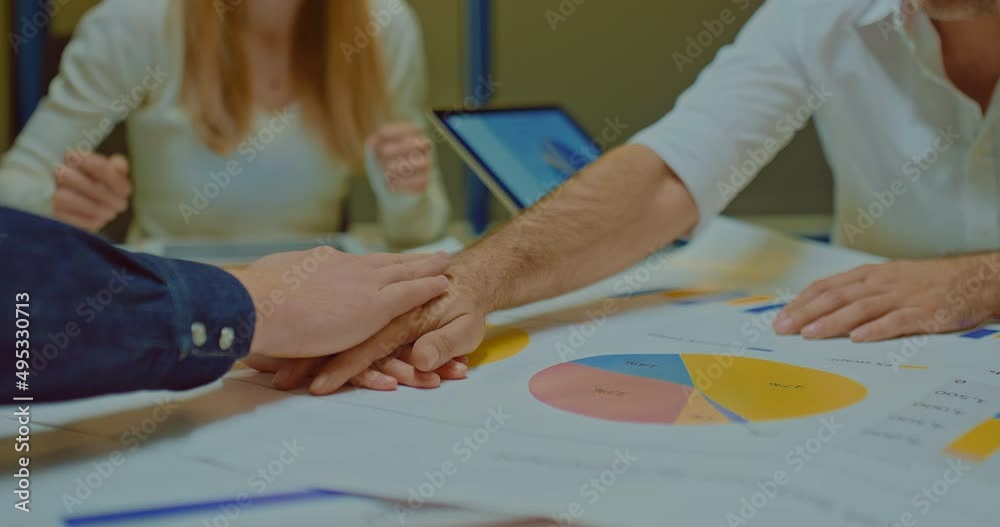 Colleagues of the company put hand on hand together, a unifying gesture before starting work. Team building in the company, successful people in the company. Close-up. 4k, ProRes Colleagues of the company put hand on hand together, a unifying gesture before starting work. Team building in the company, successful people in the company. Close-up. 4k, ProRes