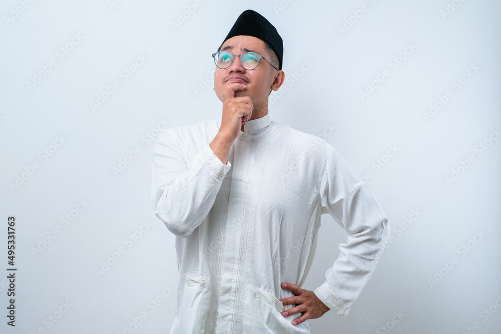 Asian muslim man doing thinking gestire, looking for idea