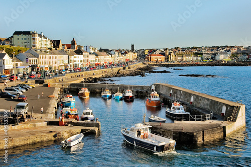 Obraz na płótnie Portstewart fishing boat harbour and main street seafront, County Derry. 3 miles from Coleraine and Portrush, Northern Ireland. w salonie