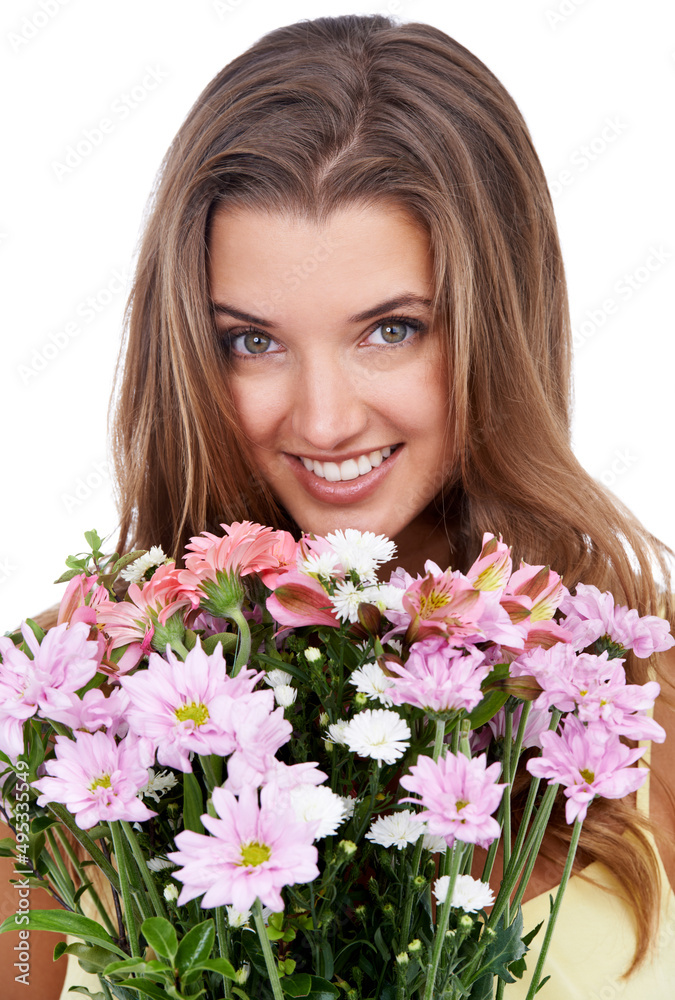 Almost as beautiful as her.... Studio shot of an attractive woman holding a bouquet of flowers. Almost as beautiful as her.... Studio shot of an attractive woman holding a bouquet of flowers.