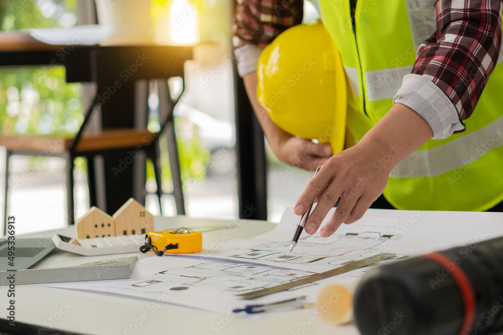 Young engineers and architects design, plan, measure the layout of ...