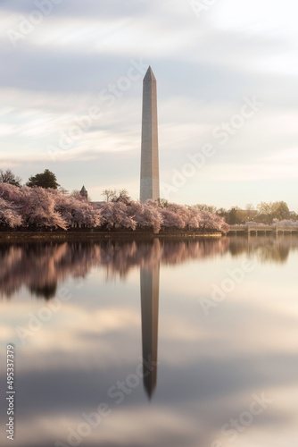 A 60 second exposure of the Tidal Basin in Washington DC smooths out the water and reflection of the Washington Monument and the springtime Cherry Blossoms.