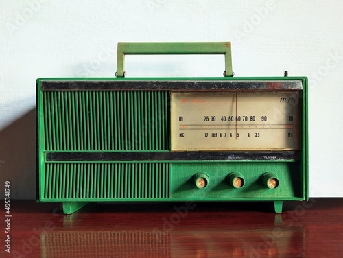 old transistor radio on wooden table