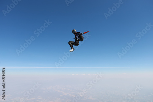 Freefly skydiving. Solo skydiver is having fun in the sky.