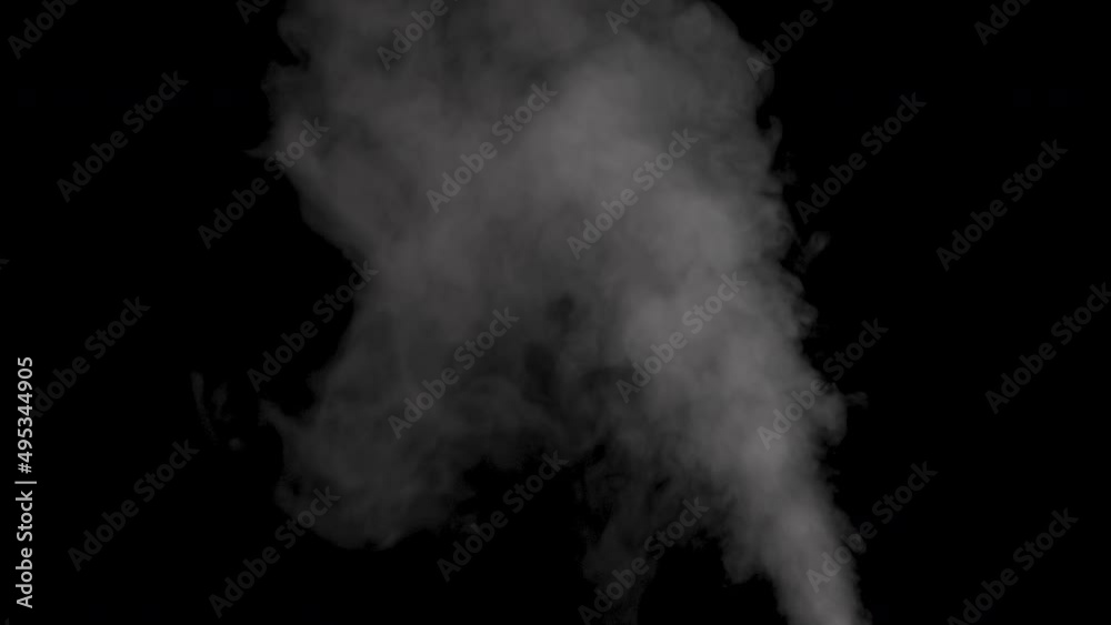 Real white steam from a humidifier on an isolated black background. Real white steam from a humidifier on an isolated black background.