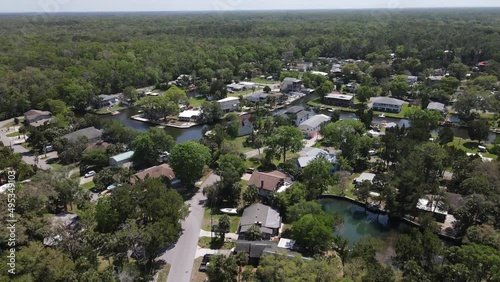 homes and forested natural preserve land in Weeki Wachee, Florida.  Aerial view shows a secluded forest on the Gulf Coast of Florida photo