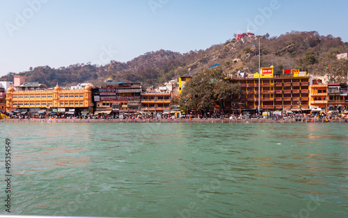 city view at the shore of flowing river at morning from flat angle photo