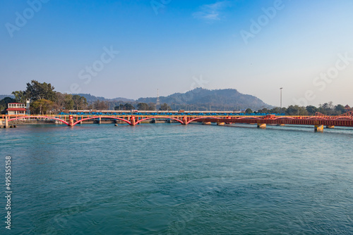 isolated iron bridge over ganges river with colorful sky at evening © explorewithinfo