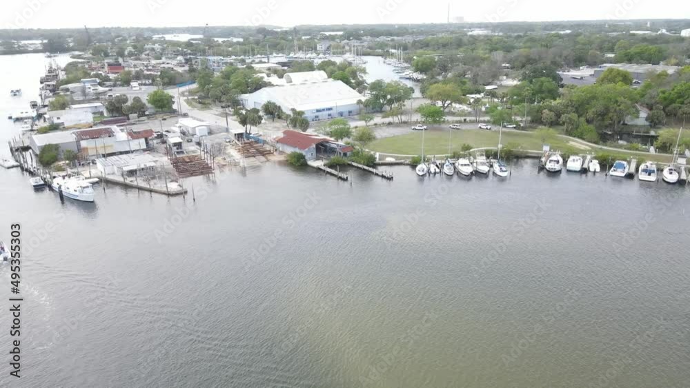 twisting aerial view of Tarpon Springs and the sponge docks the area is famous for.  The area is home to a large Greek community originally settled as a great sponge diving area