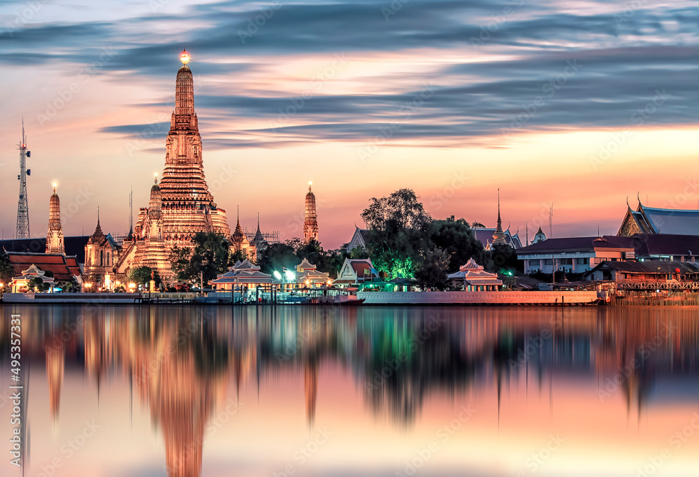 Wat Arun temple at sunset in Bangkok Thailand. Wat Arun is among the best known of Thailand's landmarks