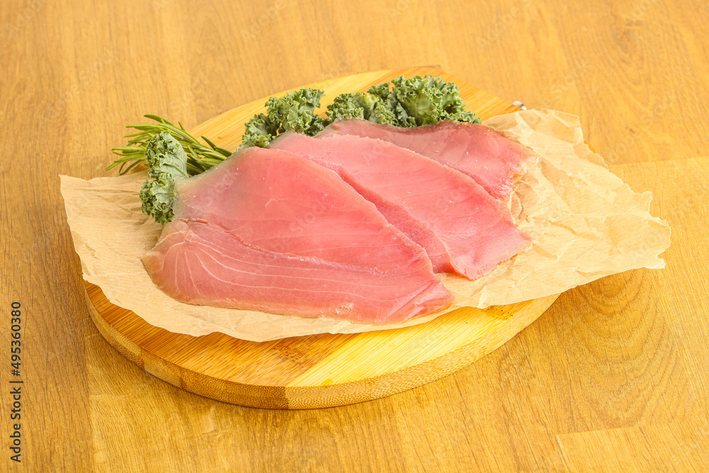 Raw salted tuna slice over board Raw salted tuna slice over board