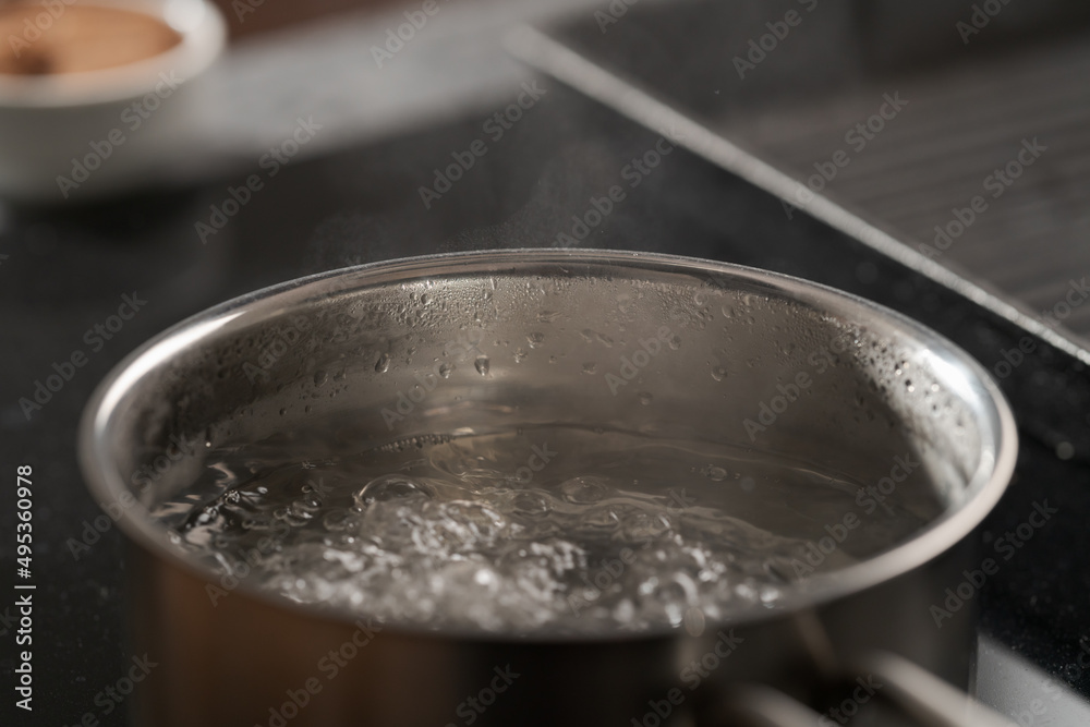 Saicepan with hot boiling water closeup Saicepan with hot boiling water closeup