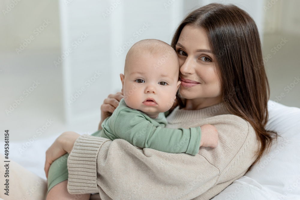 A woman with a small child. Mom with a baby. High quality photo A woman with a small child. Mom with a baby. High quality photo