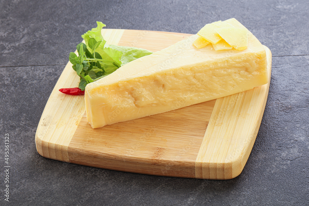Parmesan cheese piece over board