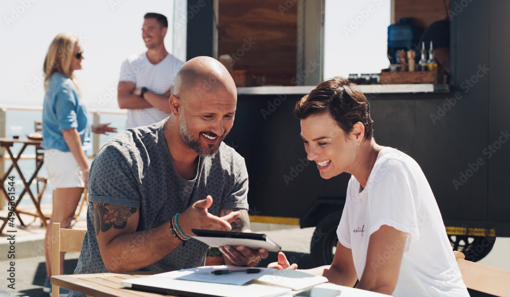 Our product page turned out great. Shot of a businessman and businesswoman working outside using a digital tablet. Our product page turned out great. Shot of a businessman and businesswoman working outside using a digital tablet.