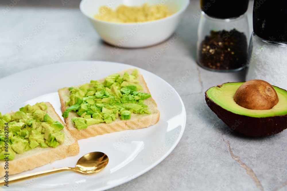 Toasts with avocado on white plate, Healthy food and dieting concept, Organic product