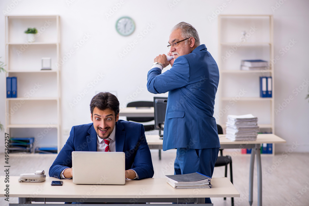 Two male colleagues working in the office Two male colleagues working in the office