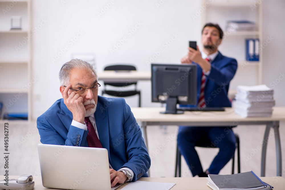 Two male colleagues working in the office Two male colleagues working in the office