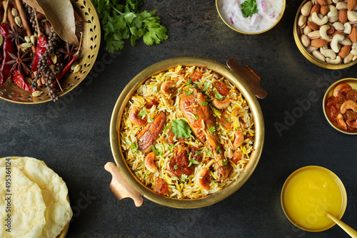 Chicken biryani Spicy Indian Malabar biryani Hyderabadi biryani, Dum Biriyani pulao golden bowl Kerala India Sri Lanka Pakistan basmati rice mixed rice dish with meat curry Ramadan Kareem, Eid