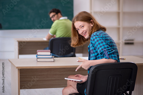 Two students sitting in the classroom