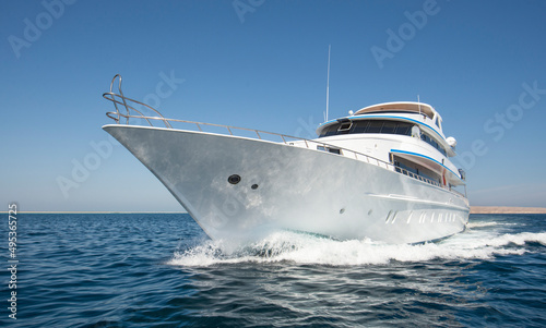 Luxury private motor yacht sailing at sea © Paul Vinten