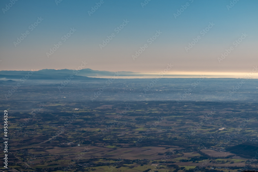 The plain and the sea from the alpine peak The plain and the sea from the alpine peak