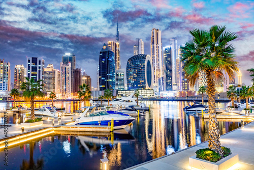Marina with yachts and skyscrapers in Dubai UAE with Burj Khalifa at night. © Photocreo Bednarek