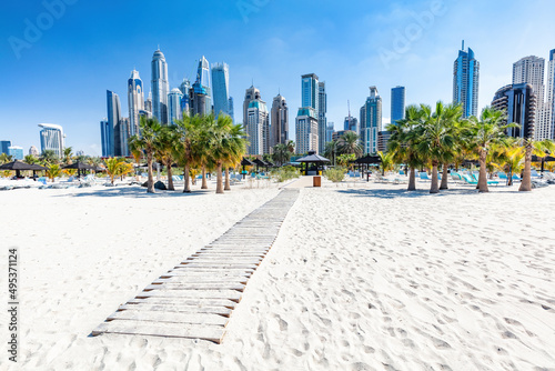 Dubai jumeirah beach with marina skyscrapers in UAE photo