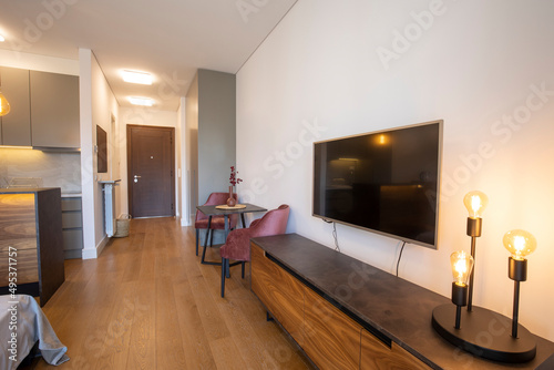 Wooden cabinet under wall mounted tv