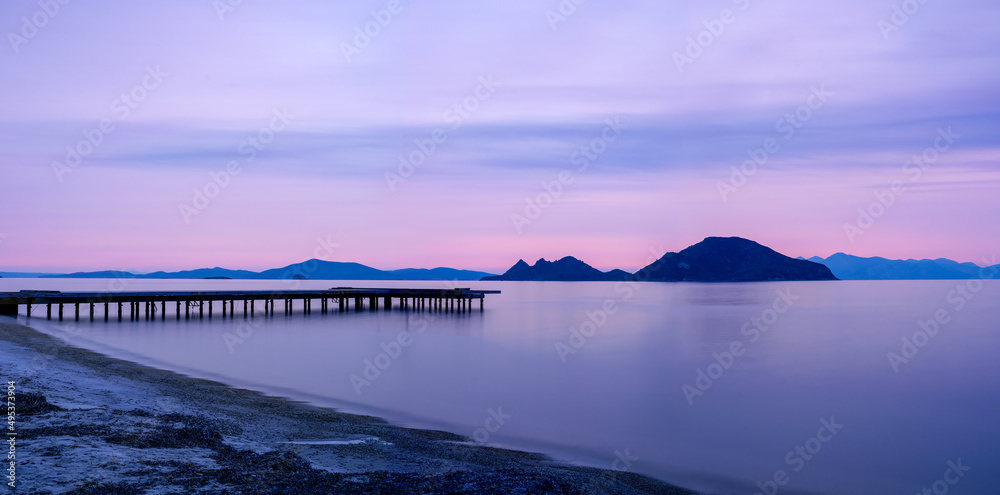 Sunset photo of Bodrum Turgutreis coastline. Travel and tourism concept.