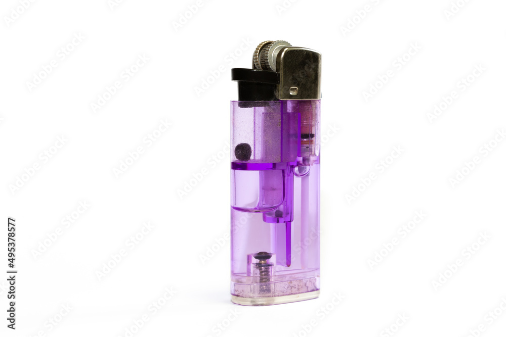 Purple colored plastic lighter on an isolated white background. Purple colored plastic lighter on an isolated white background.