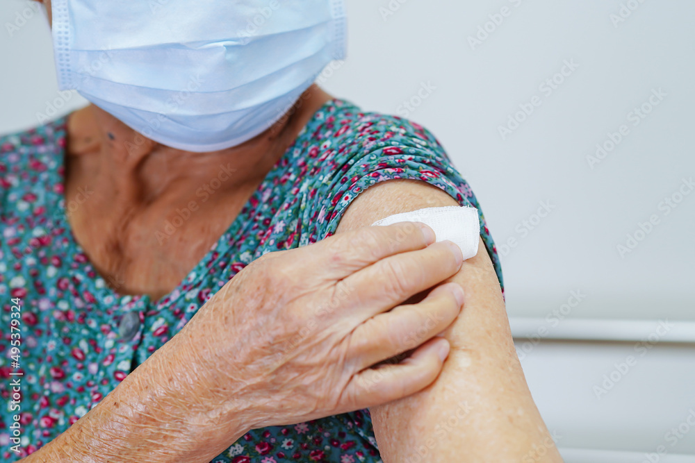 Asian elder senior woman with protective face mask getting vaccine for protect corona virus. Asian elder senior woman with protective face mask getting vaccine for protect corona virus.
