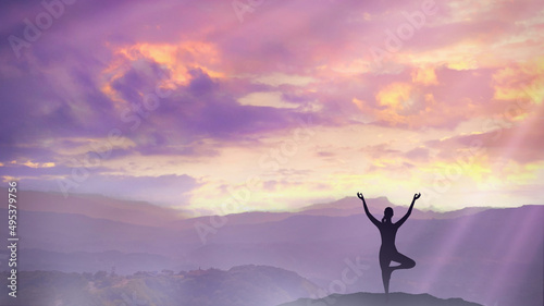 Yoga in nature. Silhouette of woman practice yoga meditation exercise outdoor. Young female sitting on mountains for relaxed yoga posture in the morning, mental health care, relaxation, meditation.