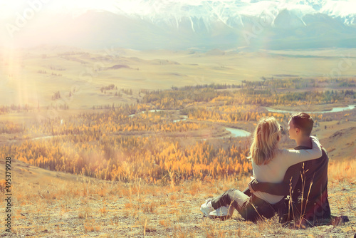 couple hugging in mountains landscape, romance happiness adventure together active