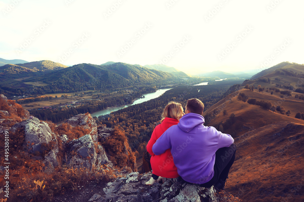 Fototapeta premium couple hugging in mountains landscape, romance happiness adventure together active