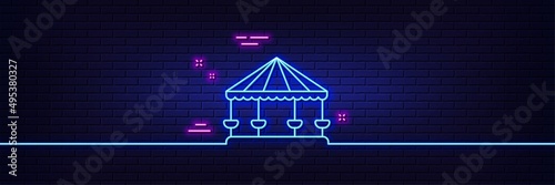 Neon light glow effect. Carousels line icon. Amusement park sign. 3d line neon glow icon. Brick wall banner. Carousels outline. Vector
