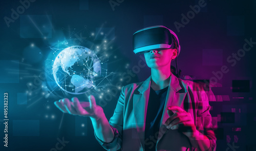 Woman with VR virtual reality goggles photo