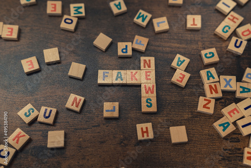 FAKE NEWS - a phrase put together perpendicularly of wooden letters social media concept. High quality photo photo