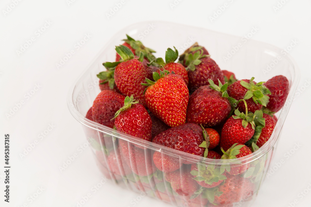 strawberries in bowl on white background strawberries in bowl on white background