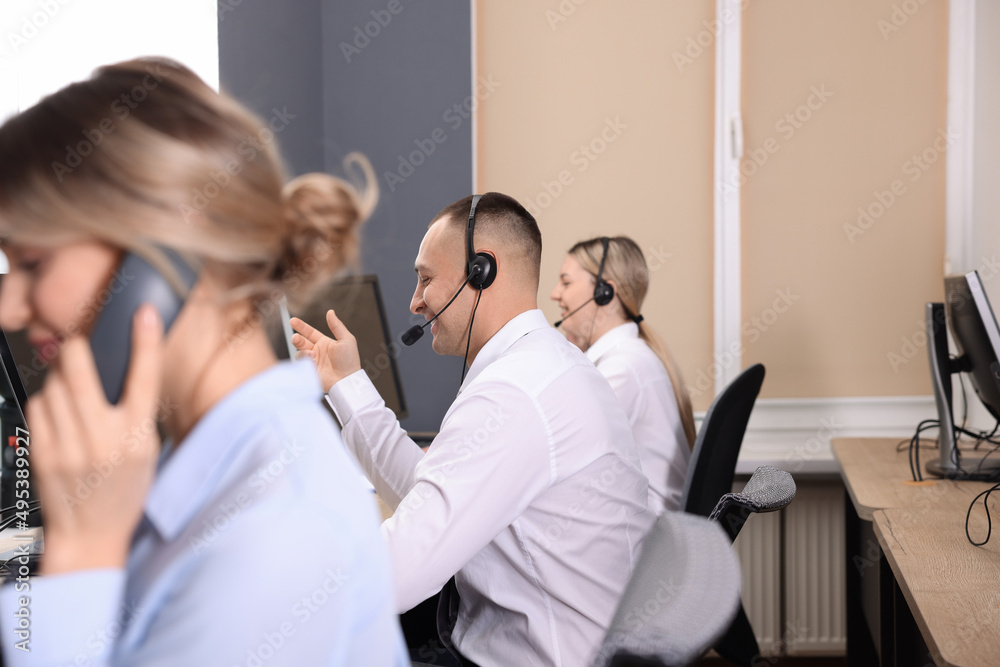 Call center operators working in modern office Call center operators working in modern office