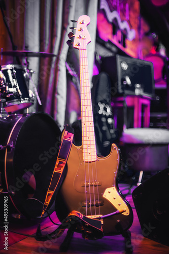 electric bass guitar on the rack at concert