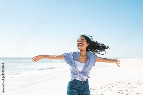 Carefree smiling woman enjoy the summer at beach photo
