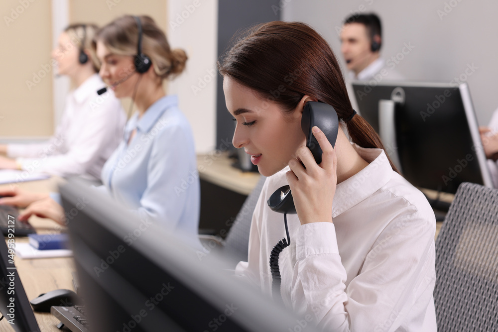 Call center operators working in modern office Call center operators working in modern office
