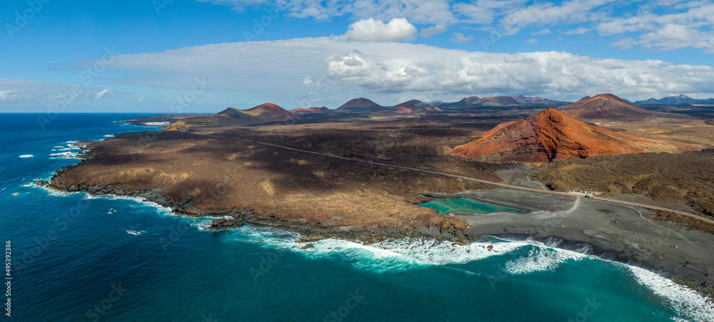 Charco Verde lake and volcan Bermeja on the island of Lanzarote, Spain