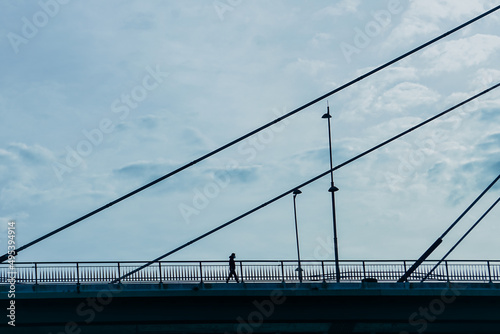 pedestrian silhouette on the bridge in Bilbao city, Spain, Travel destinations