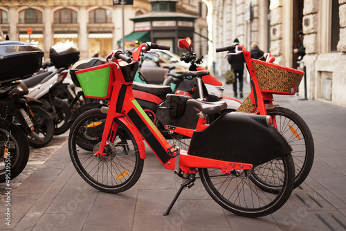 Photography Rent of orange bikes in Rome a shared bike in city