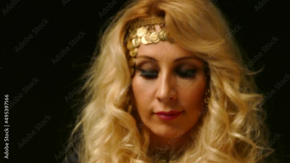Beautiful Blond Fortune Teller looking through The Crystal Ball. Beautiful Blond Fortune Teller looking through The Crystal Ball.