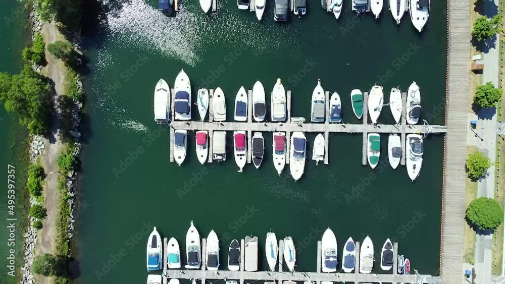 Drone Aerial Shot top down of Downtown Motorboat and Yacht Marina In summertime Drone Aerial Shot top down of Downtown Motorboat and Yacht Marina In summertime