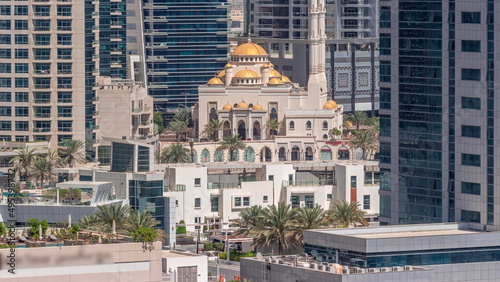 Dubai Marina skyline with Mohammad Bin Ahmed Al Mulla mosque aerial timelapse